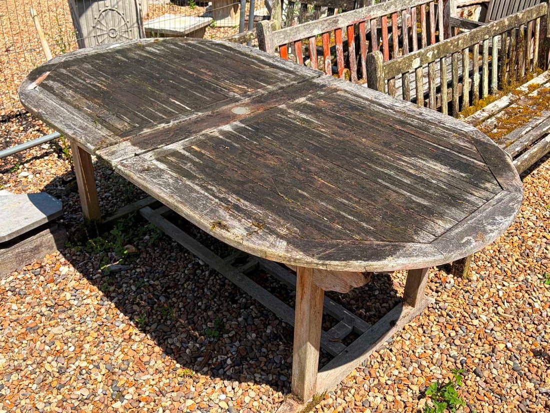 An oval teak garden table, of modern manufacture,: An oval teak garden table, of modern manufacture, together with eight matching style armchairs Table, 185cm wide approx 100cm deep 74cm high Provenance: The contents of Thornton House, Clare.
