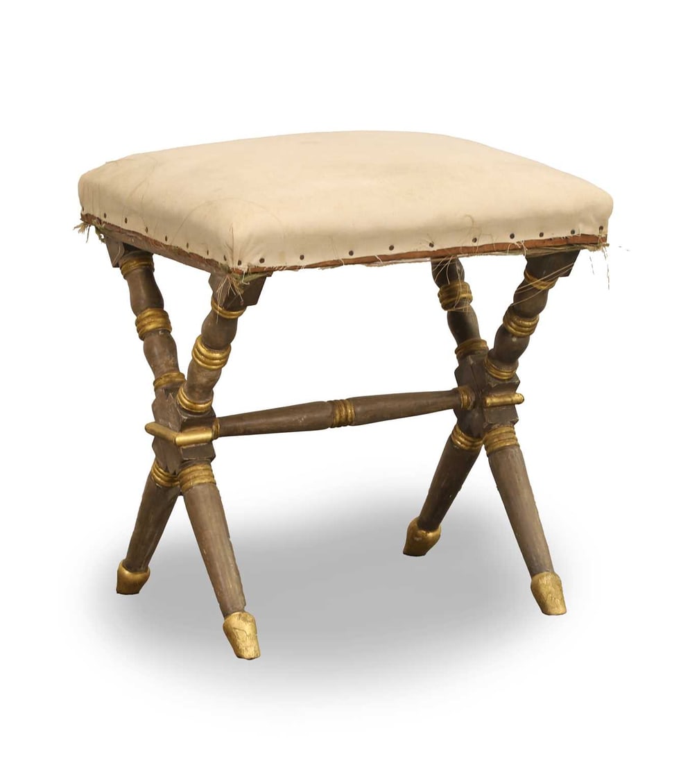 A Regency painted x frame stool, second quarter 19th century,: A Regency painted x frame stool, second quarter 19th century, on turned painted and gilded supports, with upholstered seat 41cm wide, 38cm deep, 45cm high Condition Report: The seat needs re-covering