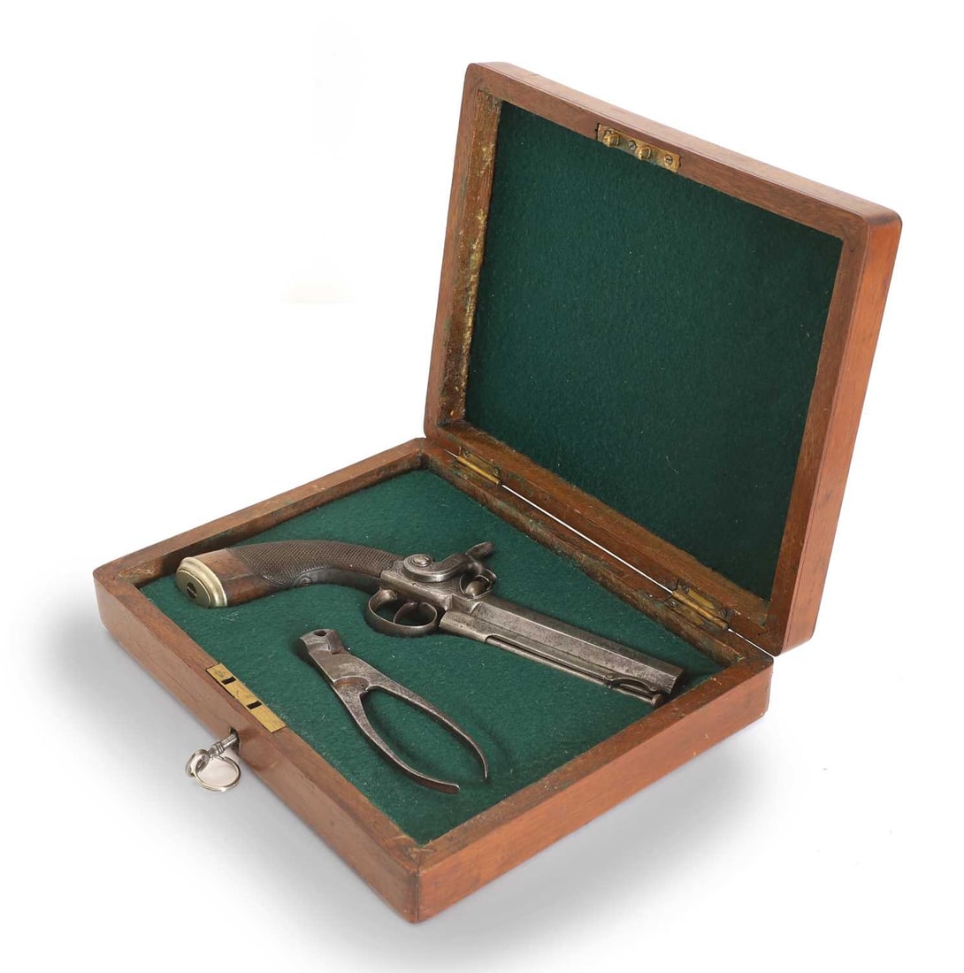 An English percussion pistol,: An English percussion pistol, Birmingham proof marks, with a walnut grip, with scissor mould, cased 22cm long, barrel, 11cm long Condition Report: obsolete. Some marks to the handle and barrel, The