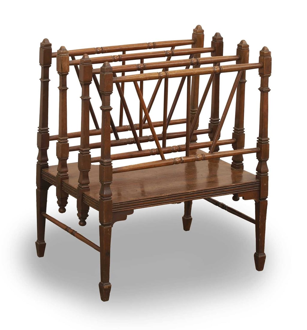 An Aesthetic movement Canterbury, late 19th century,: An Aesthetic movement Canterbury, late 19th century, with four turned sections and terminating on Malborough style tapering legs