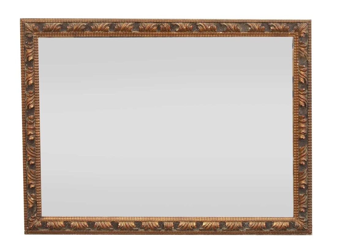 A rectangular Florentine style mirror: A rectangular Florentine style mirror with carved and painted foliate decoration to the frame and moulded wavy beading 60cm wide, 80cm high