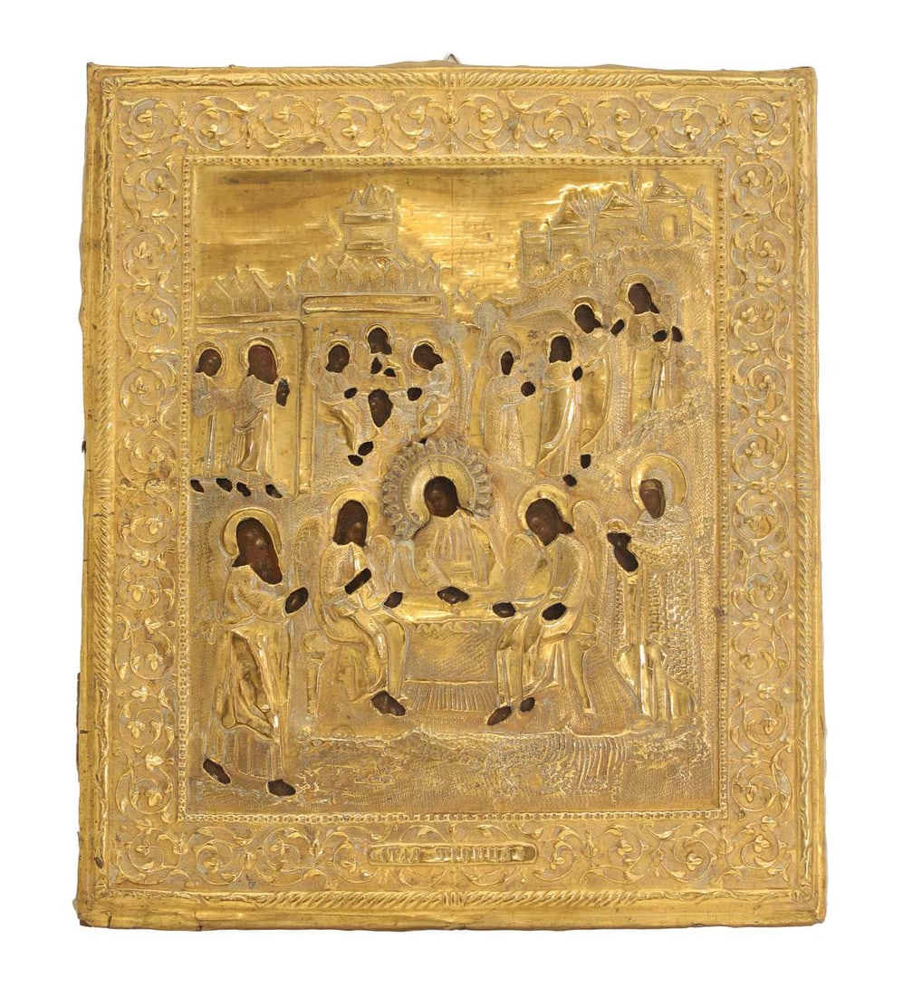 A Russian Orthodox icon 19th century,: A Russian Orthodox icon 19th century, with a white metal oklad, over the painted icon, depicting the Old Testament Trinity, inscribed on the base of the oklad 27.3cm wide, 32cm high Condition Report: 