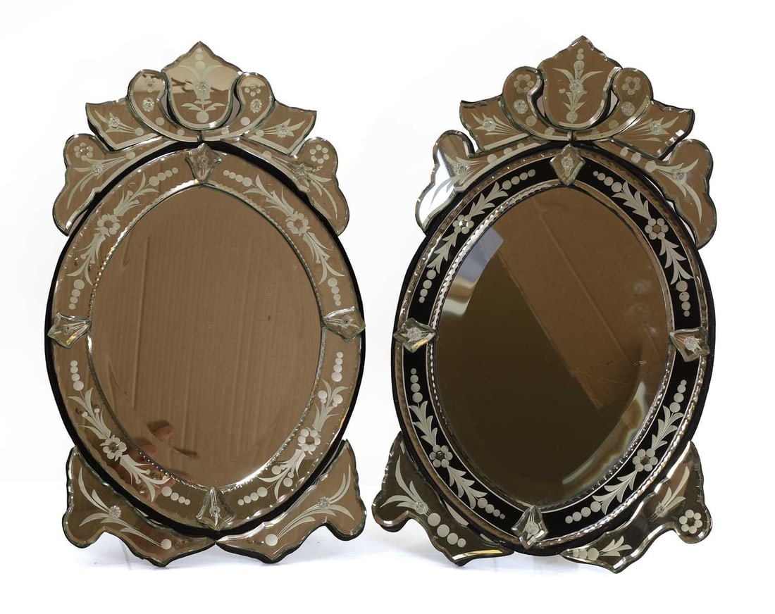 A pair of etched glass Venetian-style mirrors, of recent manuufacture,: A pair of etched glass Venetian-style mirrors, of recent manuufacture, with foliate etched decoration and surmounted with a surmount 32cm wide, 57cm high 2 Condition Report: Some peeling to the