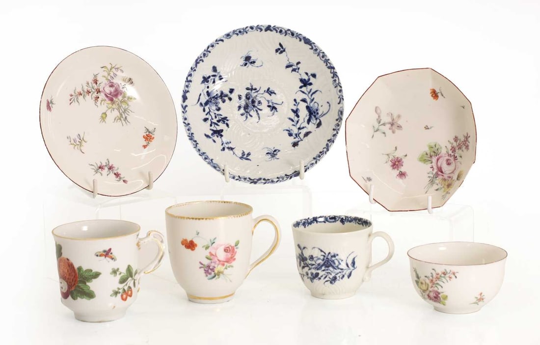 A Worcester blue and white cup and saucer, 18th century,: A Worcester blue and white cup and saucer, 18th century, decorated with a floral pattern, with a blue crescent moon mark to the base, together with five pieces of Chelsea and Chelsea-style ceramics, t