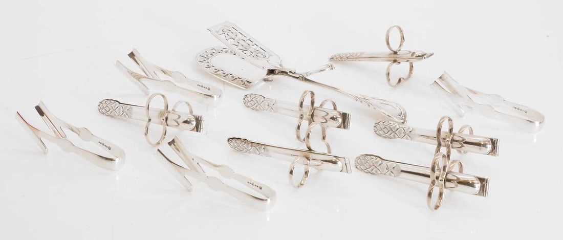 A collection of silver plated flatware,: A collection of silver plated flatware, to include a silver plated mechanical asparagus serving tong,with mechanical action, together with six French single spear asparagus tongs, silver plated, and