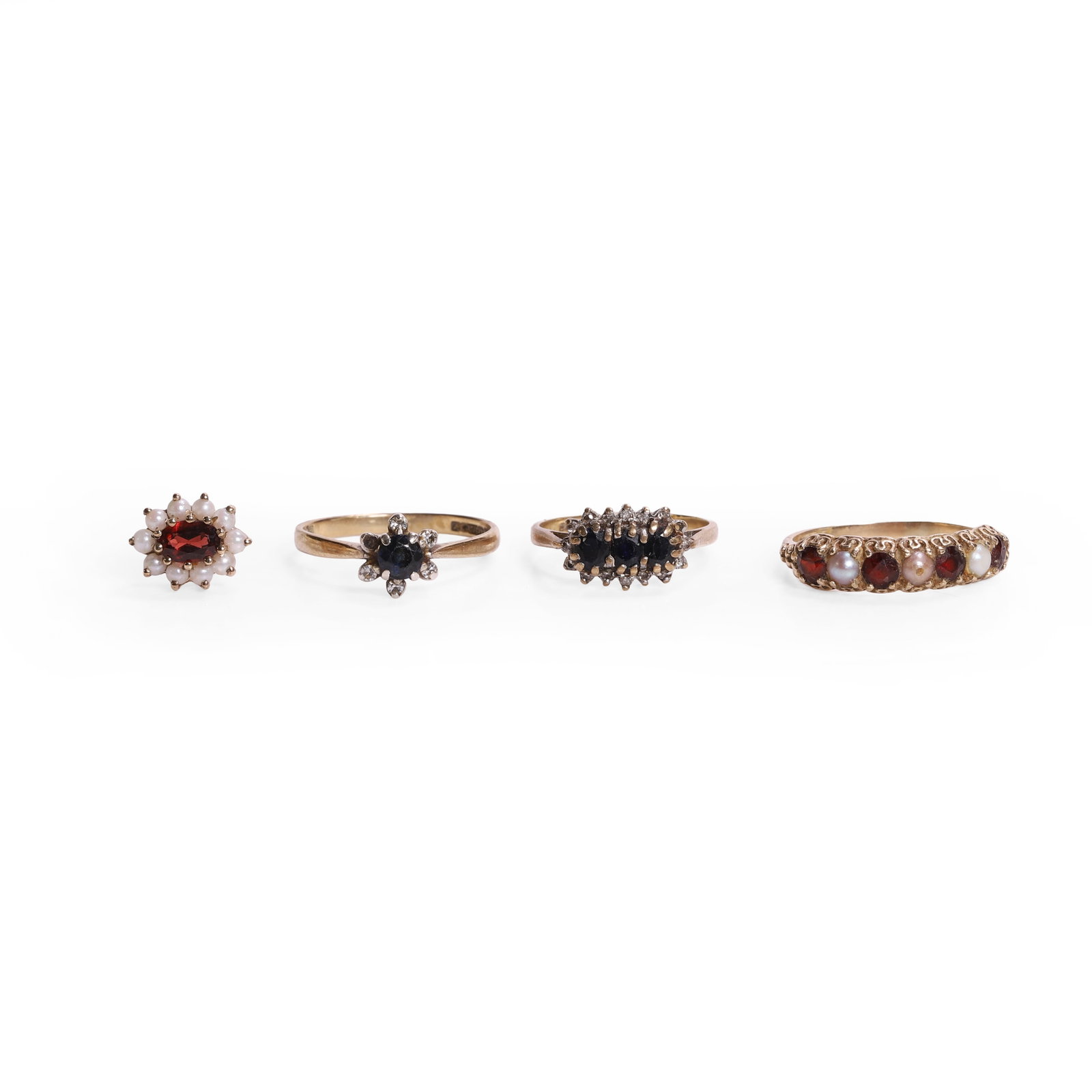 A group of three 9ct gold rings and a single cluster earring,: A group of three 9ct gold rings and a single cluster earring, comprising one seven stone garnet and pearl set half hoop ring, one sapphire and single cut diamond cluster ring, one three stone oval sap