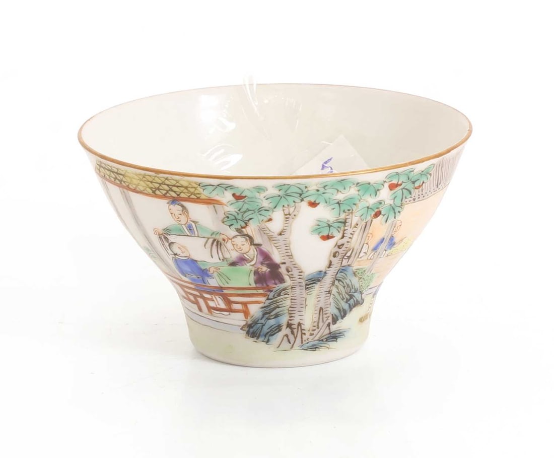 A Chinese famille rose teabowl,: A Chinese famille rose teabowl, of ogee form, and painted with figures enacting various pursuits, one side with an inscription, with an iron-red four-character Jiaqing mark to base 9cm diameter Condit