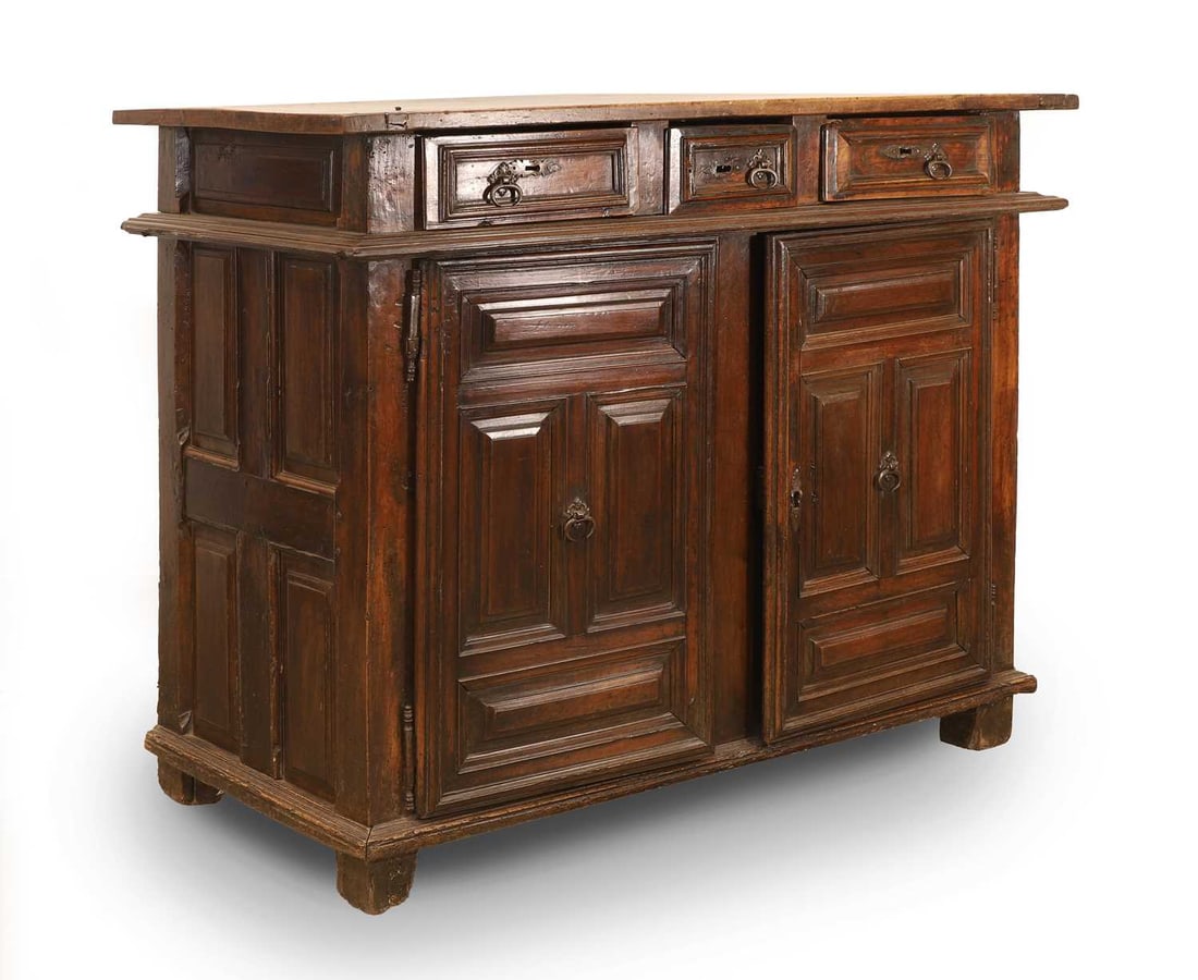 A walnut chest, 17th century and later, Northern European,: A walnut chest, 17th century and later, Northern European, with three short drawers over a pair of cupboard doors, with moulded rims 125cm wide, 64cm deep, 102cm high Condition Report: Knocks and scuf