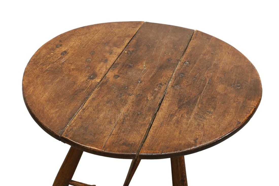 A George III walnut and elm cricket table, - 2