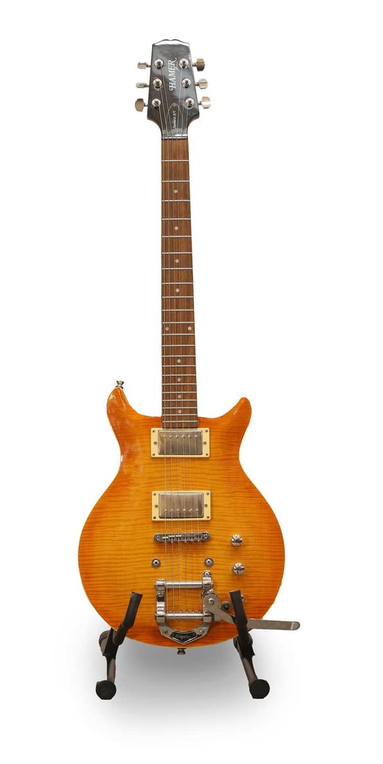 A Hamer XT Series 'Sunburst A/T' electric guitar,: A Hamer XT Series 'Sunburst A/T' electric guitar, the double cutaway body with a highly figured top in a light caramel finish, complete with an aftermarket Bigsby tremolo Condition Report: The Bigsby 