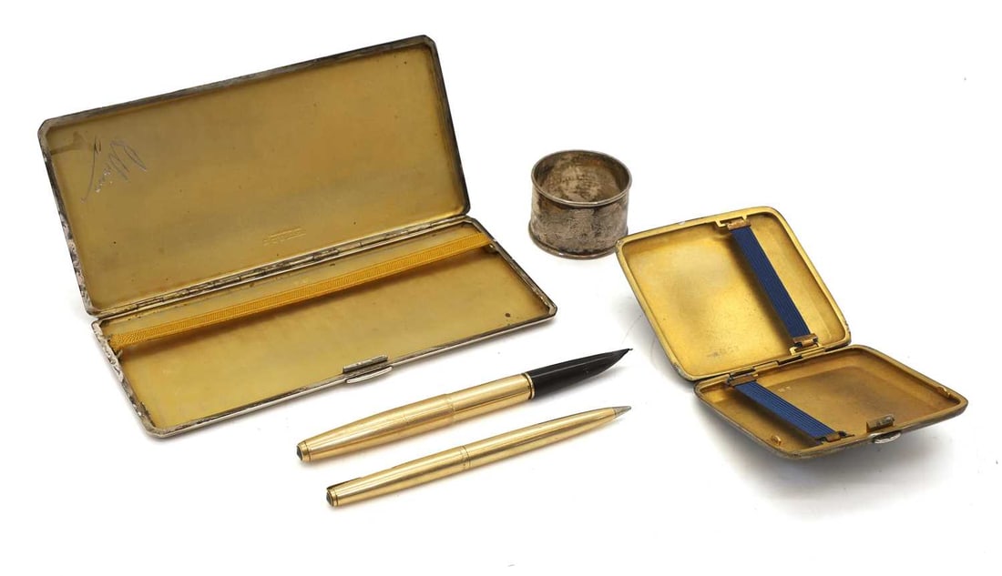A silver cigarette case, - 2