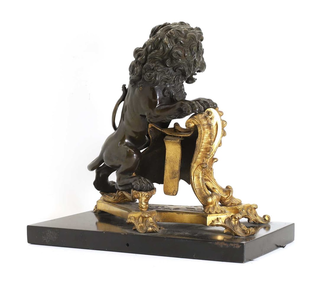 A gilt and patinated bronze animalier chenet, 19th century, - 2