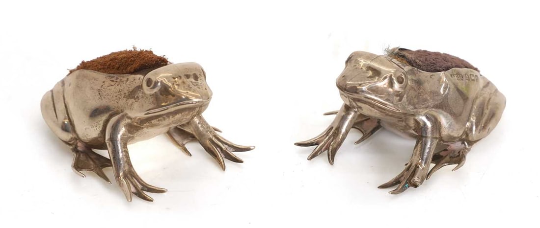 A pair of novelty silver pin cushions or pen wipes, marks worn, early 20th century,