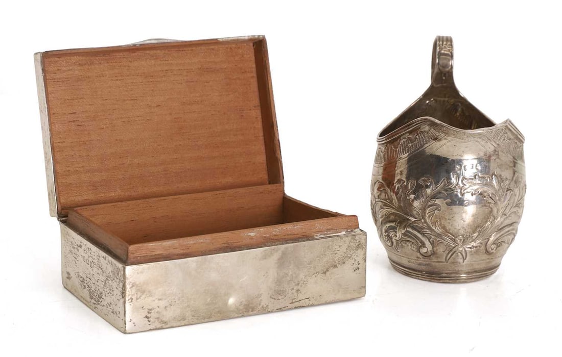 A George III silver cream jug and a cigarette box, - 2