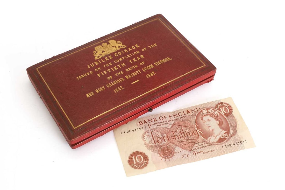 A tooled leather case marked 'Jubilee Coinage 1837-1887' (1 of 2)