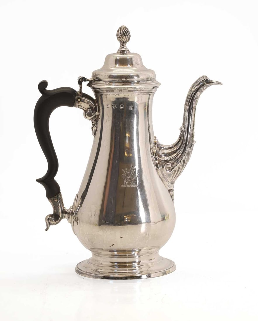 A George III silver coffee pot,: A George III silver coffee pot, makers marks M, London, 1763, engraved to the base 'I R' and crested with a griffin 25.5cm high, 25.9ozt