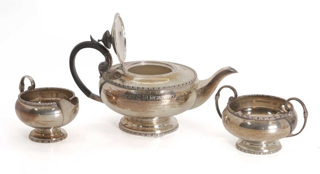 A silver three-piece tea set, - 2