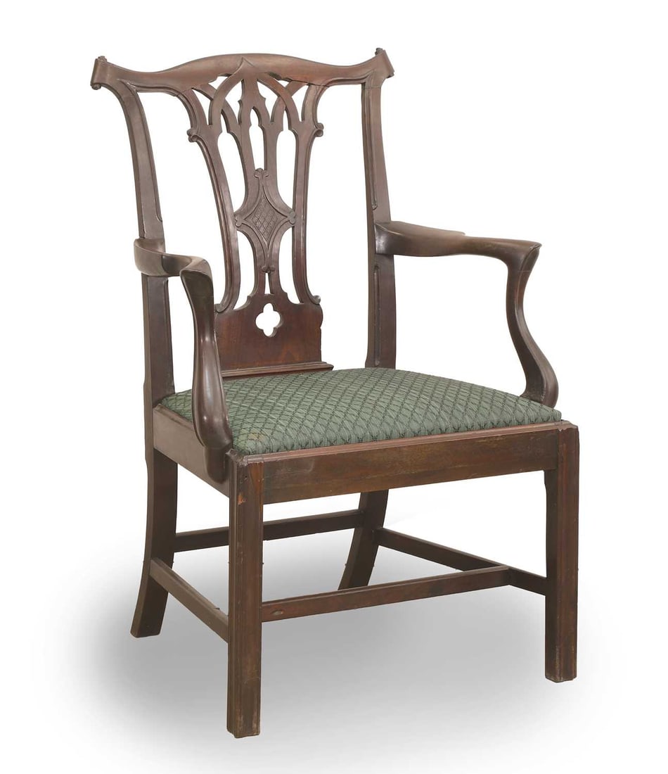 A George III Gothic armchair, late 18th century,: A George III Gothic armchair, late 18th century, the vertical fretwork centre splat over a green drop in seat, 67.5cm wide, 58.5cm deep, 100.5cm high Condition Report: with knocks and marks, minor