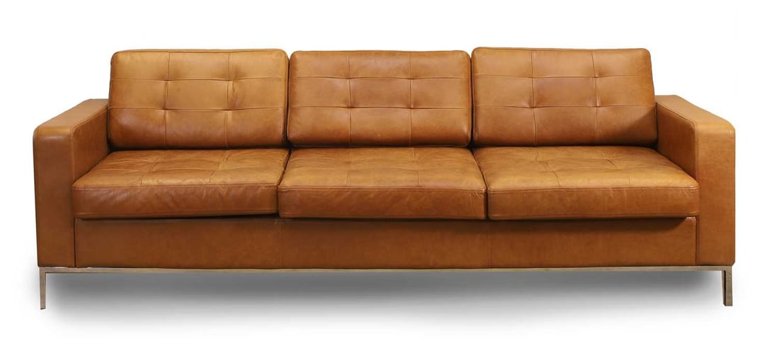 A chrome and tan leather three seater settee, of modern manufacture, (1 of 2)
