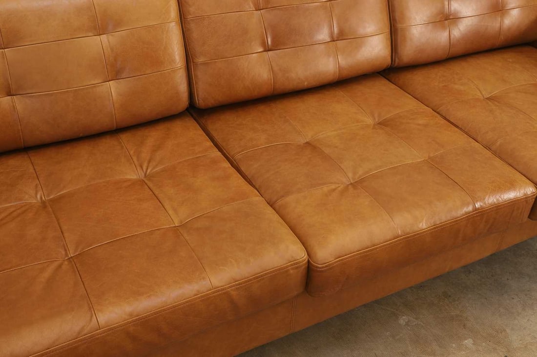 A chrome and tan leather three seater settee, of modern manufacture, - 2