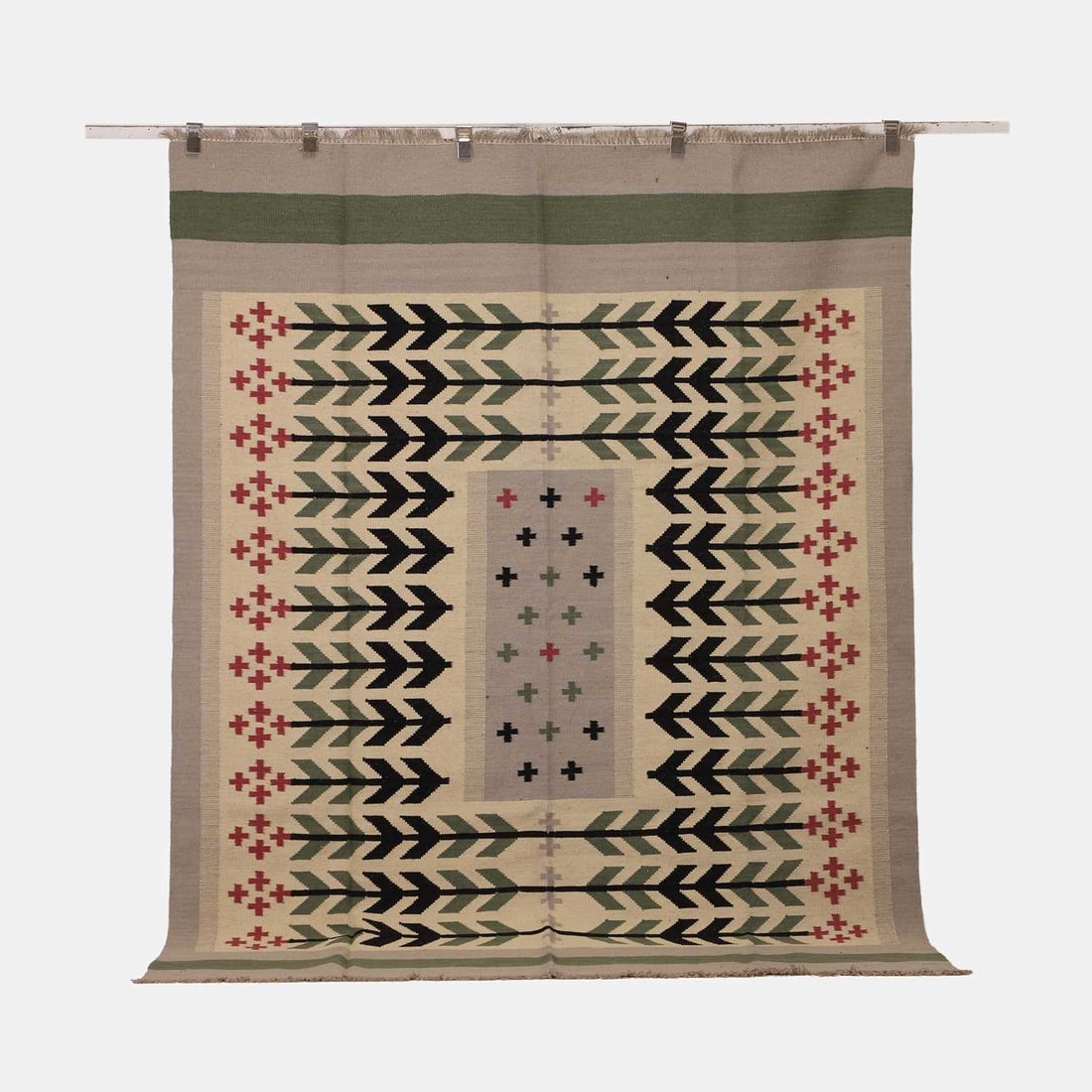 Scandinavian-inspired, a flat-weave wool kilim,: Scandinavian-inspired, a flat-weave wool kilim, of recent manufacture, the central panel decorated with cross motifs in green, black and red to a grey ground, bordered by a repeating geometric pattern