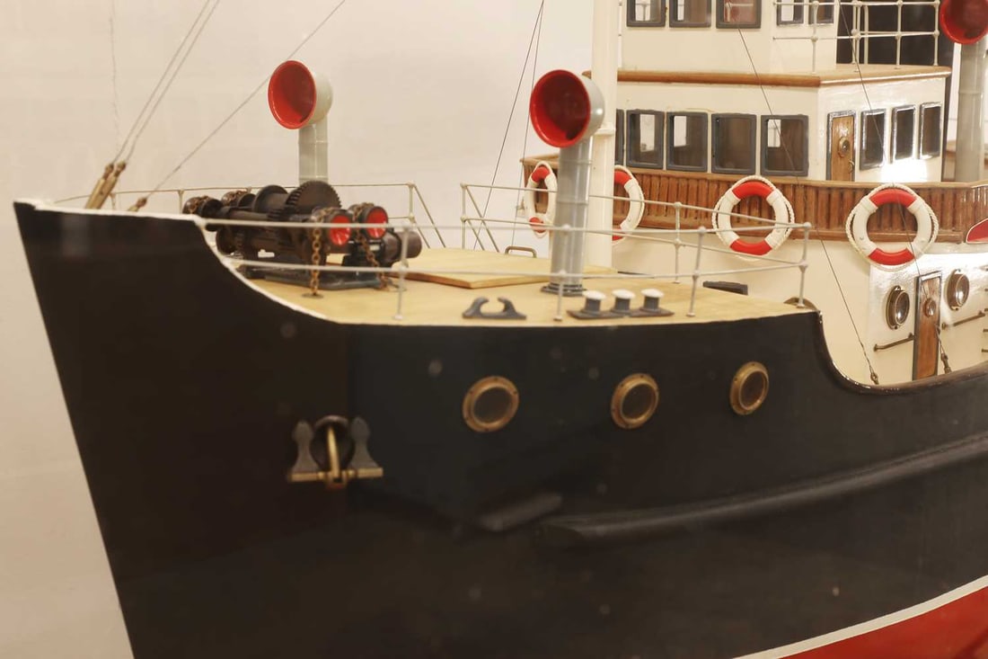 A cased model tug boat, - 3
