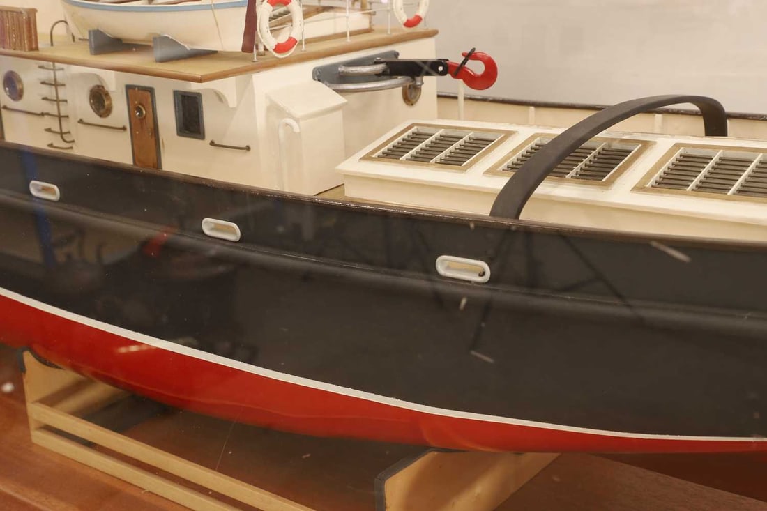 A cased model tug boat, - 6