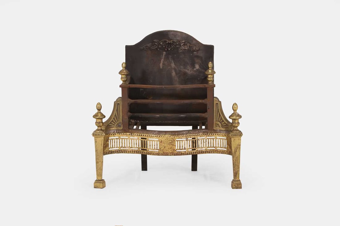 A George III-style brass and iron fire grate, late 19th / early 20th century,: A George III-style brass and iron fire grate, late 19th / early 20th century, surmounted by brass finials, raised on tapering legs and block feet 61cm wide, 35cm deep, 63cm high Condition Report: Sign