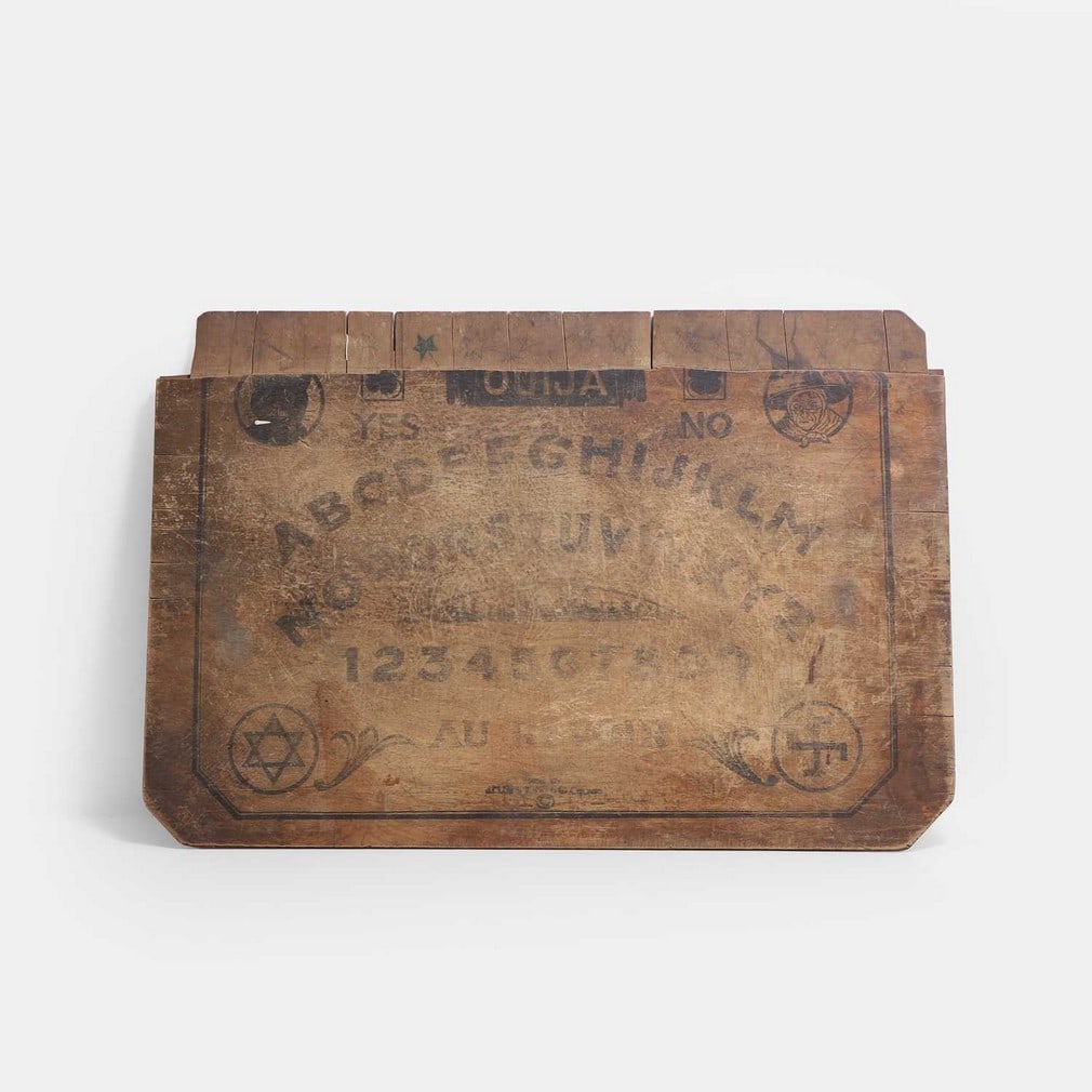 A Ouija board, early to mid-20th century, (1 of 2)