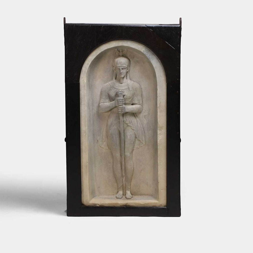 An intriguing Egyptianesque marble niche carving, probably 19th century, formerly the property of: An intriguing Egyptianesque marble niche carving, probably 19th century, formerly the property of Sir Henry Rider Haggard (1856-1925) at Ditchingham House, Norfolk, the standing figure carved basso-re