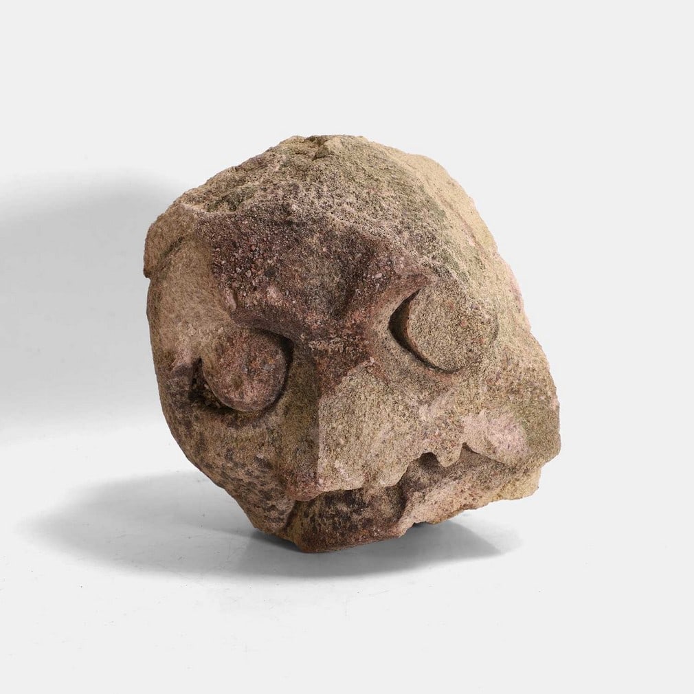 A medieval sandstone carved corbel gargoyle head,: A medieval sandstone carved corbel gargoyle head, naively carved (19cm wide, 20cm deep, 20cm high) Condition Report: Signs of age, various chips, green colour to part of the head.