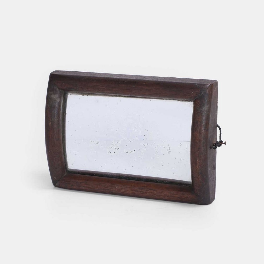A curved illusion mirror, 20th century, (1 of 2)
