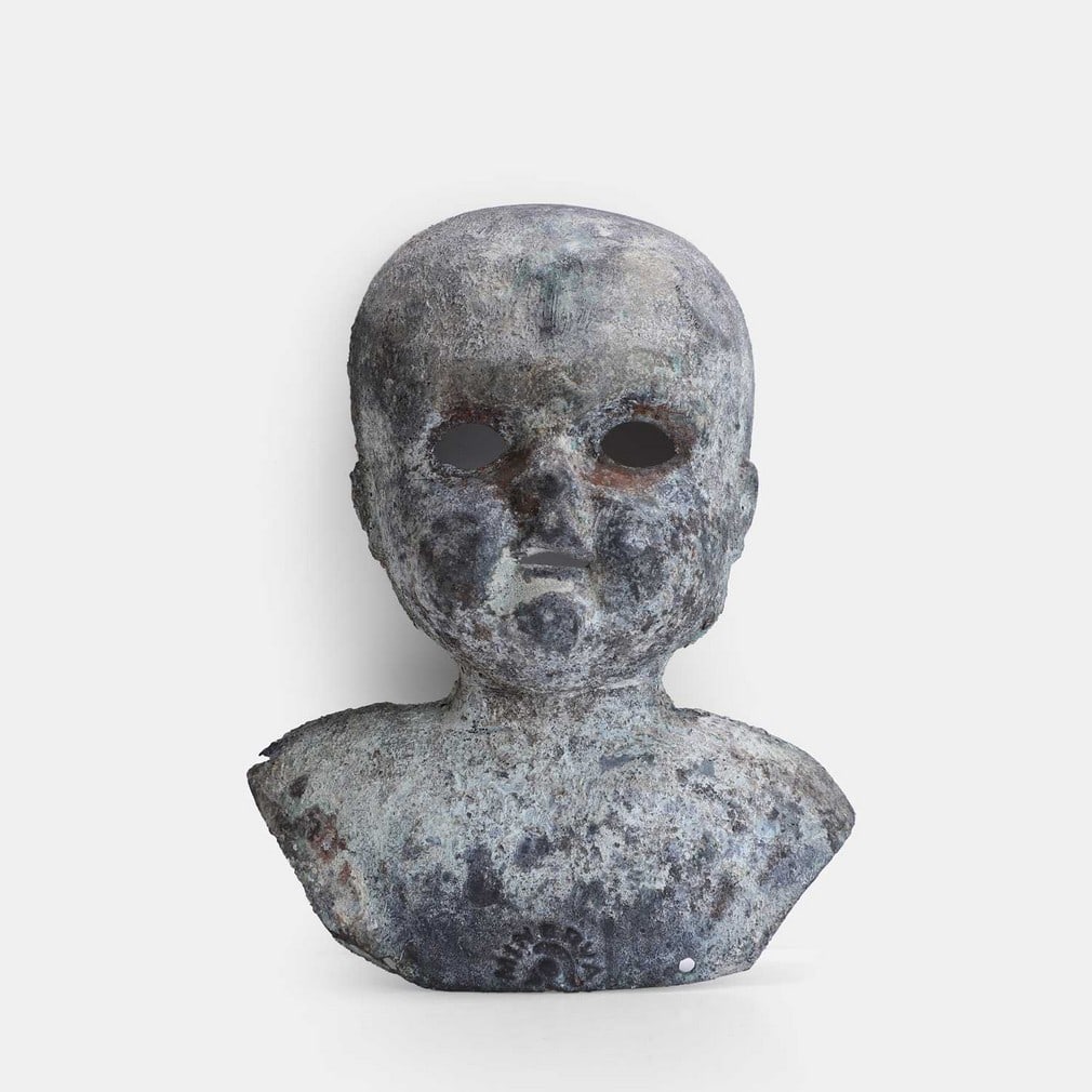 A cast metal doll's head mould, early 20th century, (1 of 2)