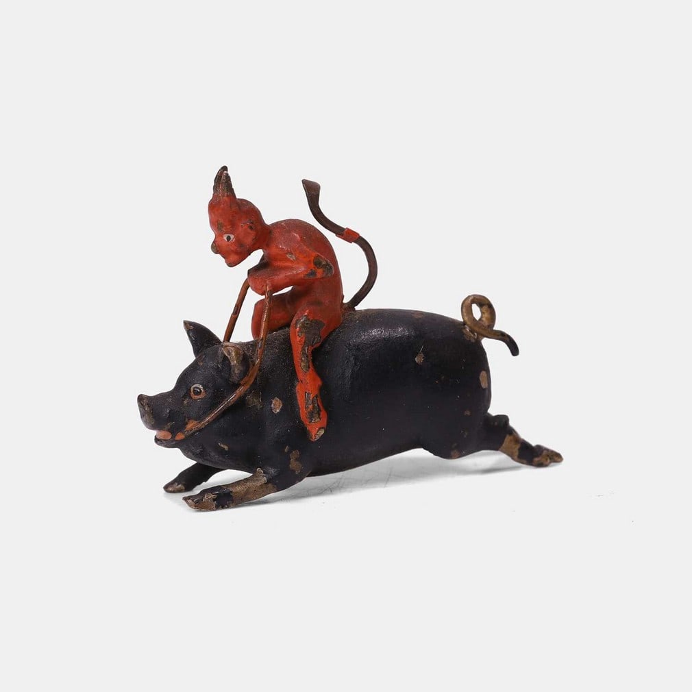 A novelty Austrian cold-painted devil on a pig figure, late 19th century, (1 of 2)