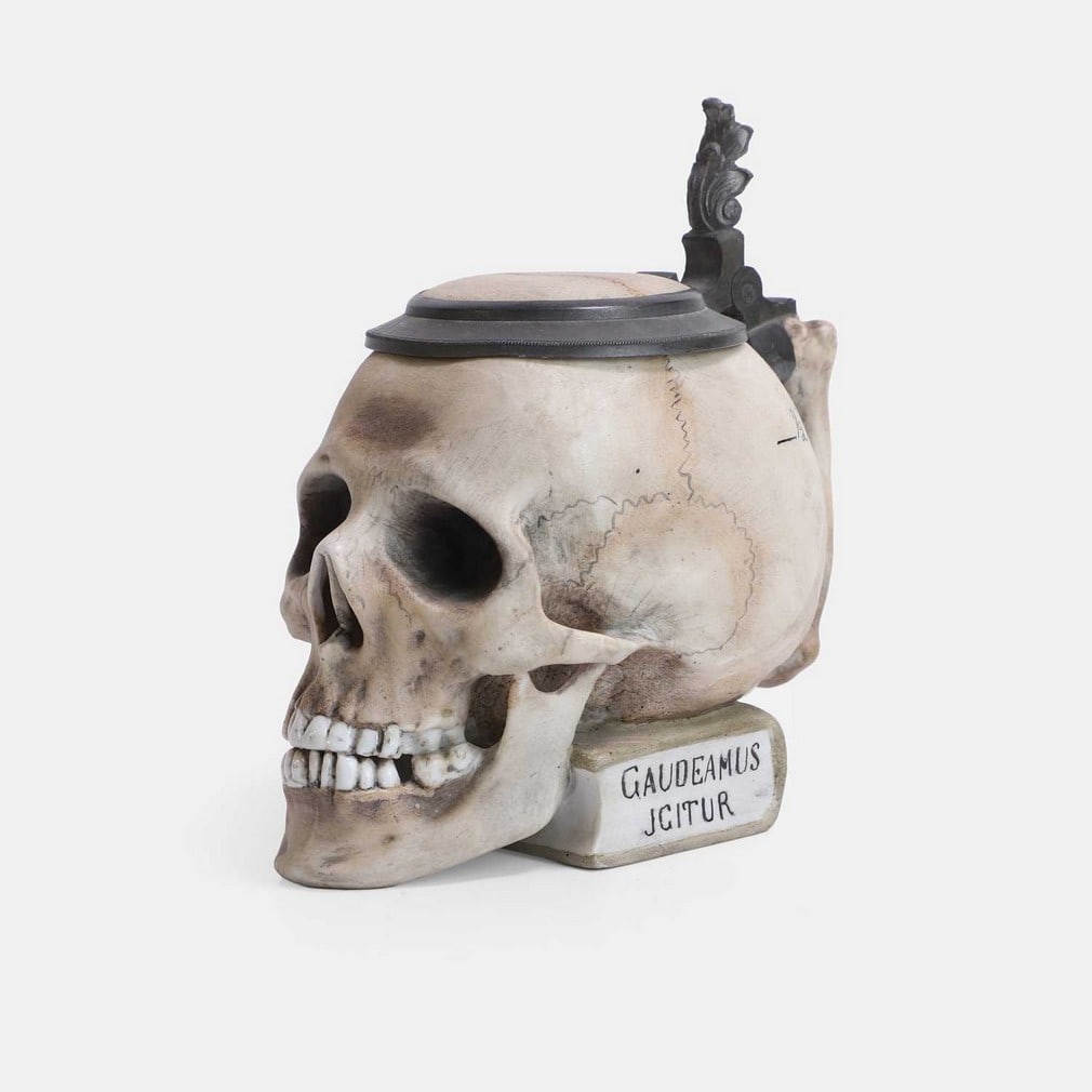 A novelty porcelain 'skull' beer stein and cover, late 19th century, German, (1 of 2)