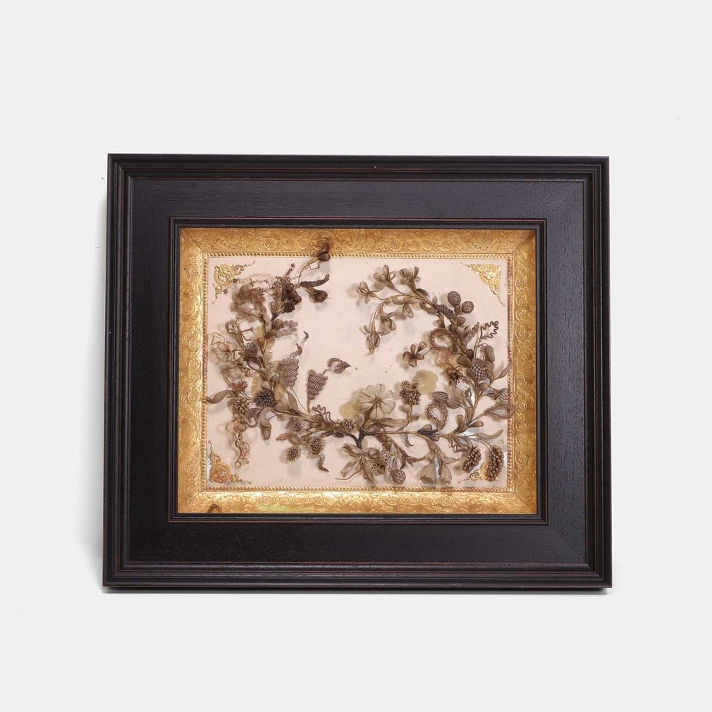 An elaborate hair picture, circa 1860, probably American,: An elaborate hair picture, circa 1860, probably American, in the form of a wreath, with flowers, foliage and a trail, about a wire frame, within a gilt-bordered and glazed box frame (41 x 48cm) Proven