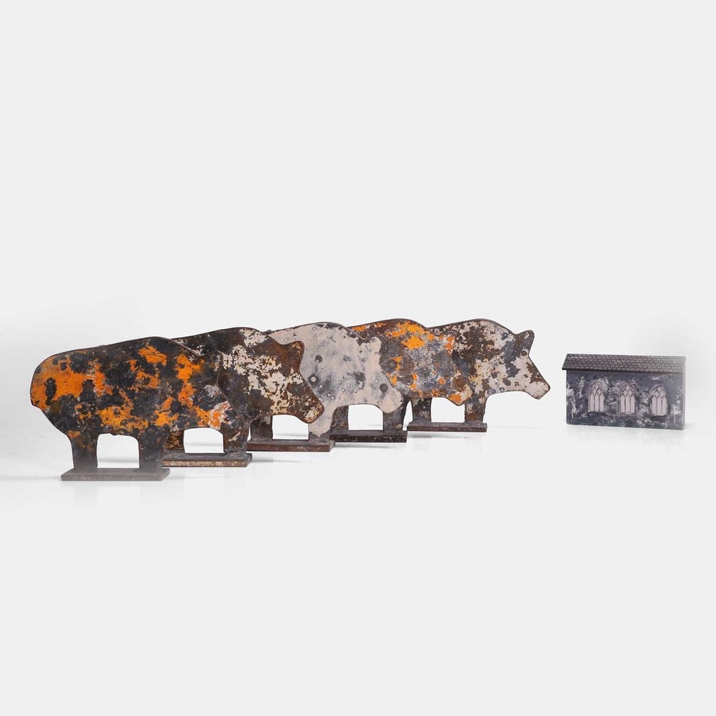Five fairground pig targets, 20th century,: Five fairground pig targets, 20th century, each of fret-cut metal, with remnants of paint, on rectangular plinths (21.5cm wide, 4cm deep 15cm high) (5) Condition Report: Used.