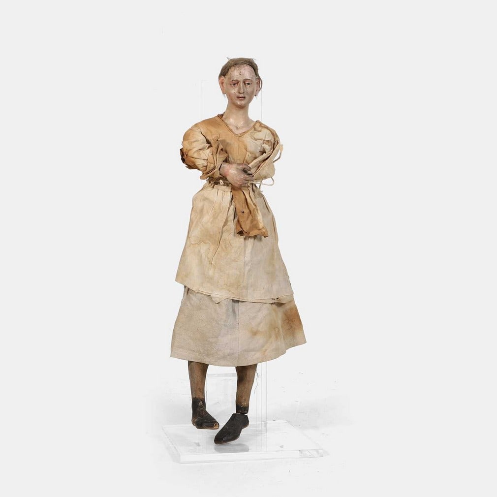 Our Lady of the Sorrows' processional figure, early 19th century, European,: Our Lady of the Sorrows' processional figure, early 19th century, European, carved and polychrome painted, with hair, an articulated right arm and legs, and the face painted with tears, wearing linen 