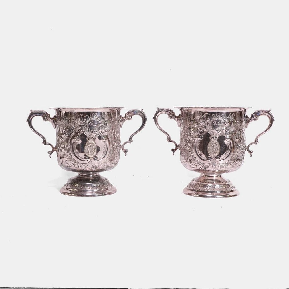 An unusual pair of plated Britannia metal 'Cruft's Dog Show' trumpet vases, circa 1900, (1 of 2)