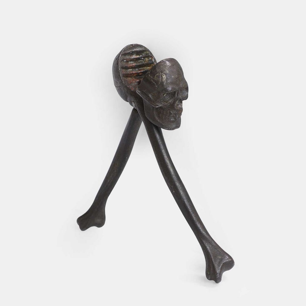 A fiendish pair of cast iron skull-and-crossbones nutcrackers, late 19th century, (1 of 2)