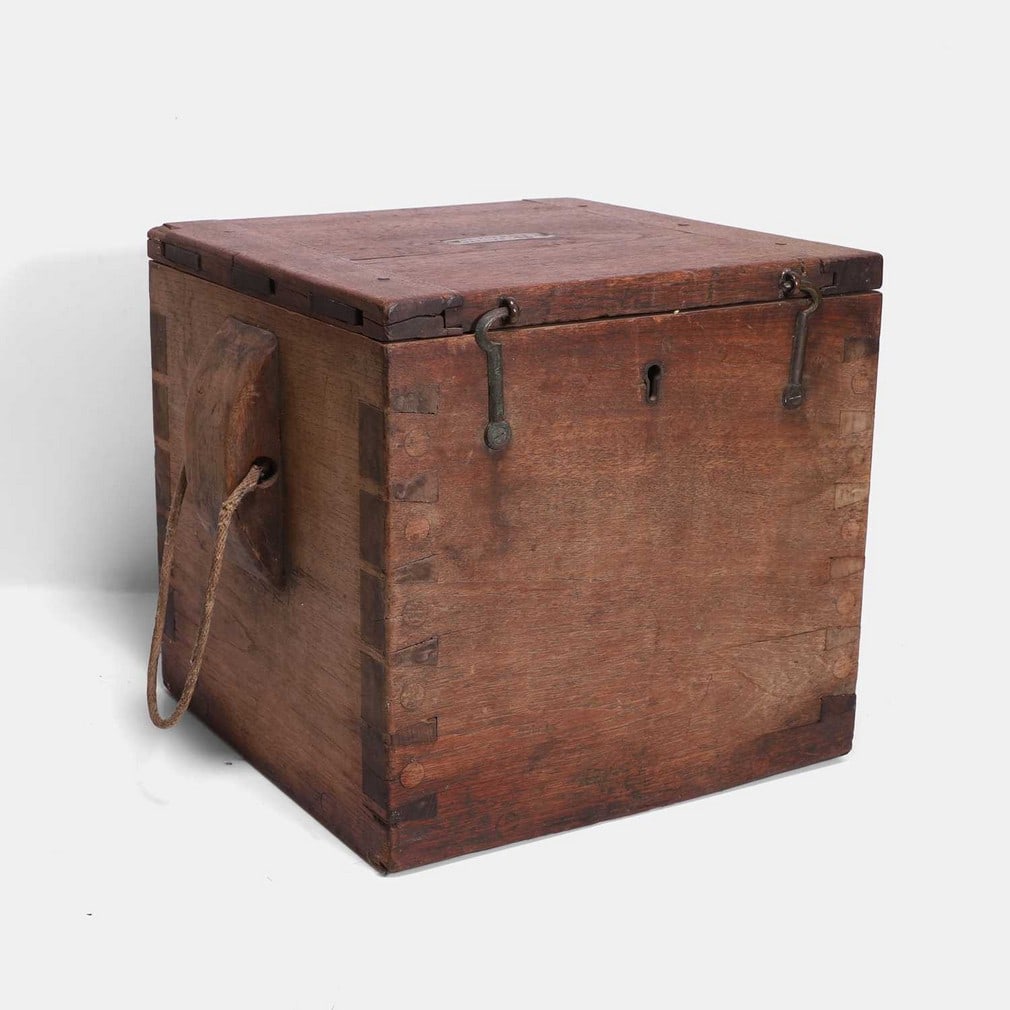 Military interest: a rare Gatling gun drum ammunition box, circa 1880,: Military interest: a rare Gatling gun drum ammunition box, circa 1880, the teak box with a hinged lid, inset with a brass plaque inscribed 'Box for Drum Gatling .45', with brass hooks and lock, and ro