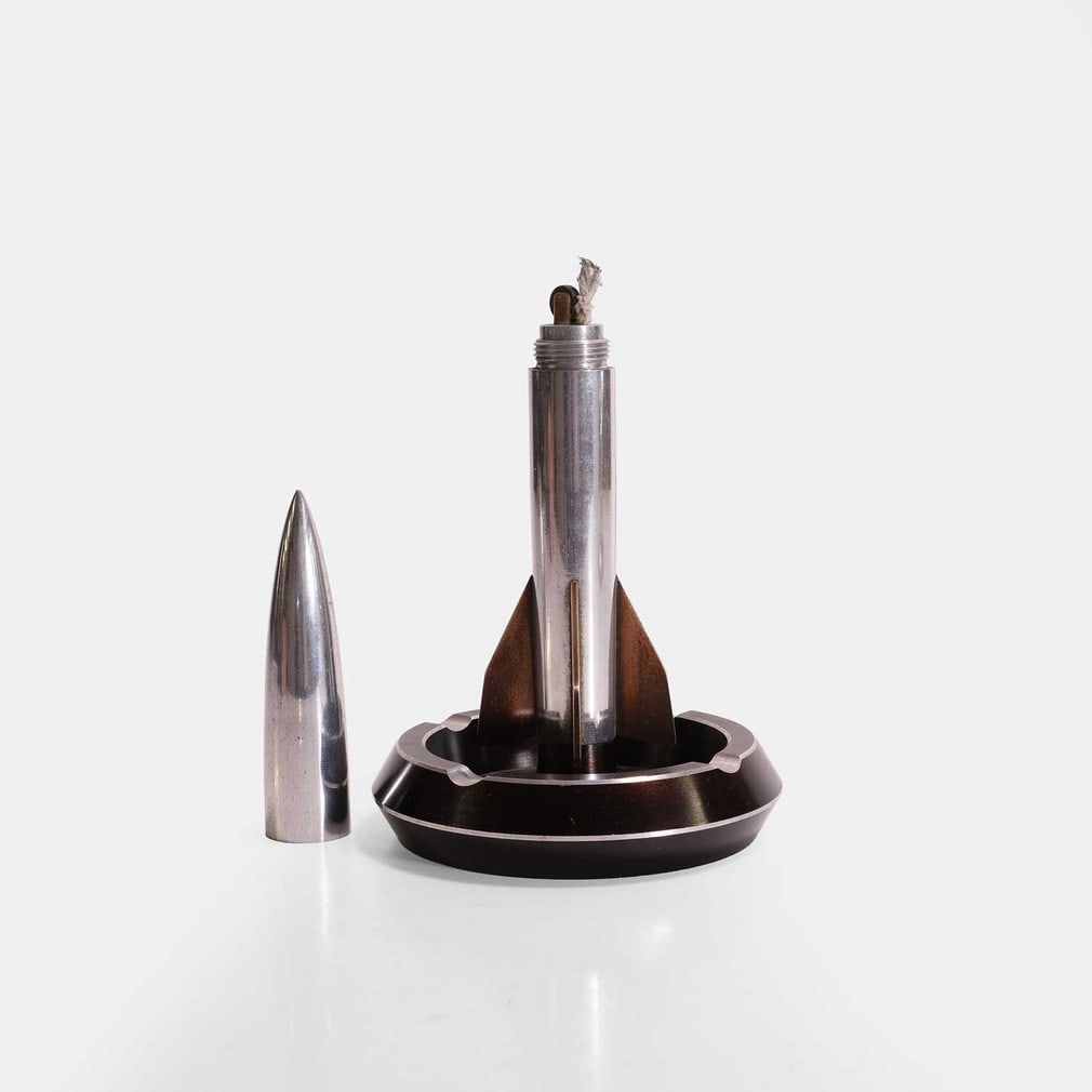 A Second World War alloy model of a V2 rocket as a desk lighter, circa 1944, (1 of 2)