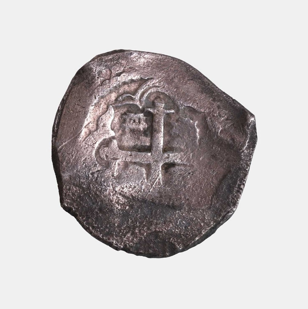 A silver 'pieces of eight' shipwreck treasure coin, dated 1729, (1 of 2)