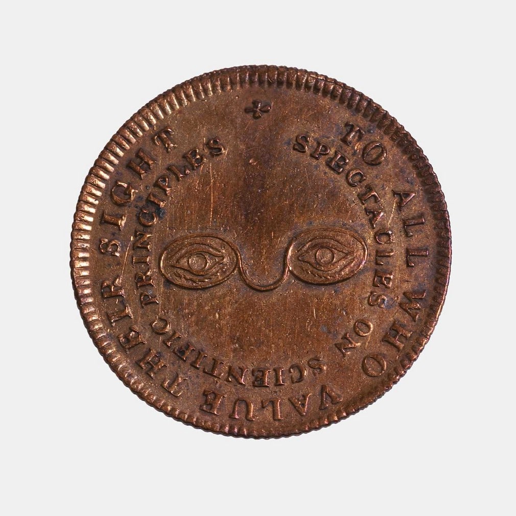 An optician's token, 19th century, (1 of 2)