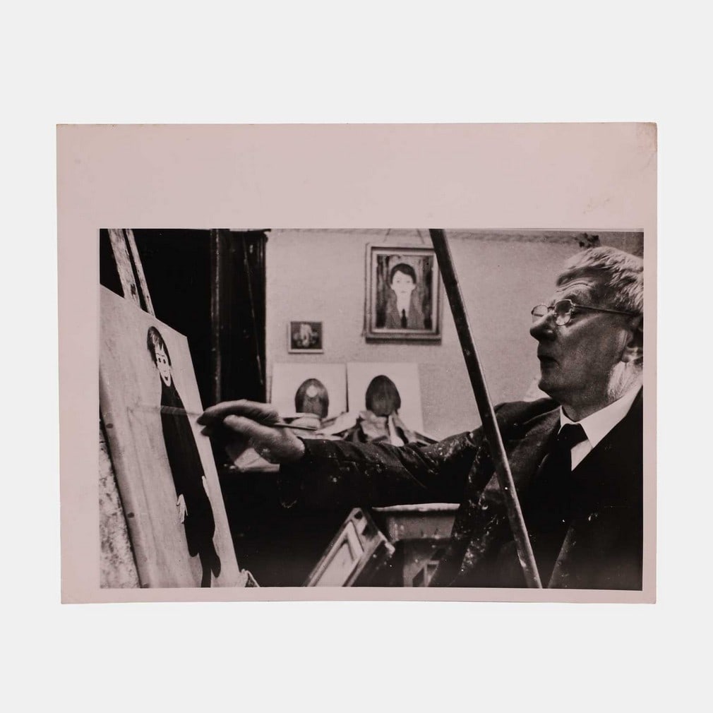 Photographs of LS Lowry in his studio, circa 1963,: Photographs of LS Lowry in his studio, circa 1963, two, the reverse stamped 'Please return to TV Times picture library, 1971' (20 x 25.5cm) (2) Condition Report: One marked up with red pencil ready fo
