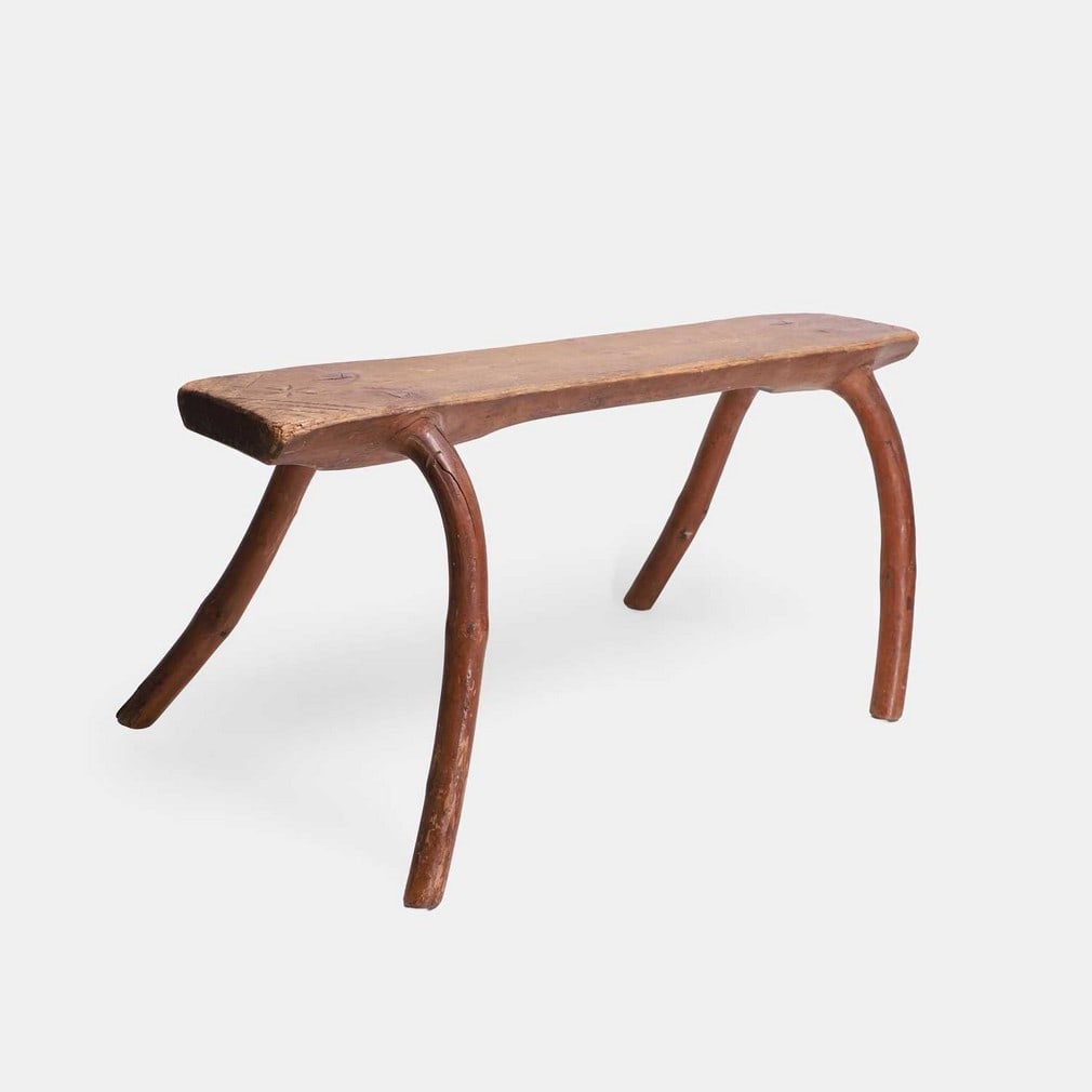 A folk art pine farmer's stool, late 19th century, possibly Swedish, (1 of 2)