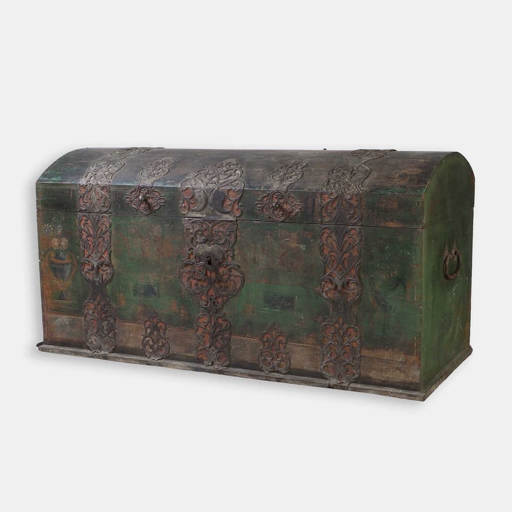 A European painted and iron-bound marriage chest, dated 1875,: A European painted and iron-bound marriage chest, dated 1875, with a domed top, painted with flowers and urns, with the original lock and key (160cm wide, 70cm deep, 84cm high)