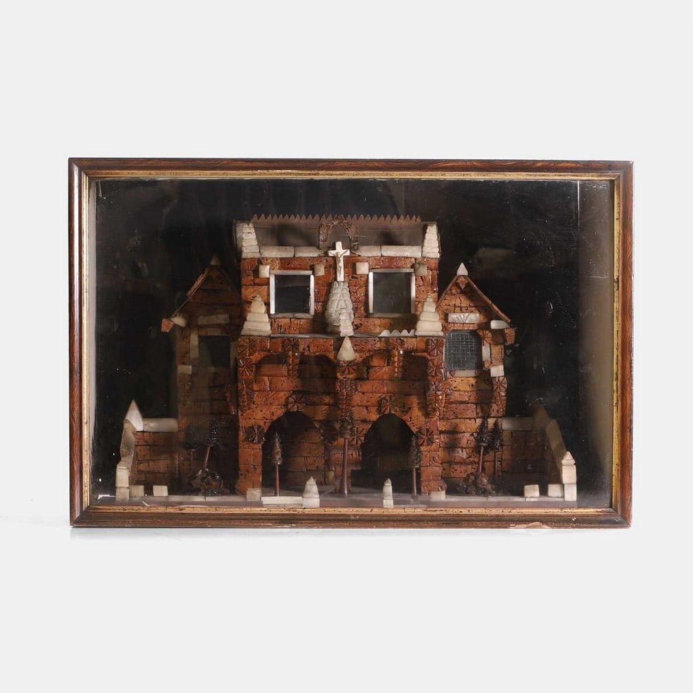 A folk art cork diorama of a spooky house, late 19th century,: A folk art cork diorama of a spooky house, late 19th century, the house with selenite crystal decorations and a crucifix, in a black and woodgrained case (55.5cm wide, 24cm deep, 36cm high) Footnote: 