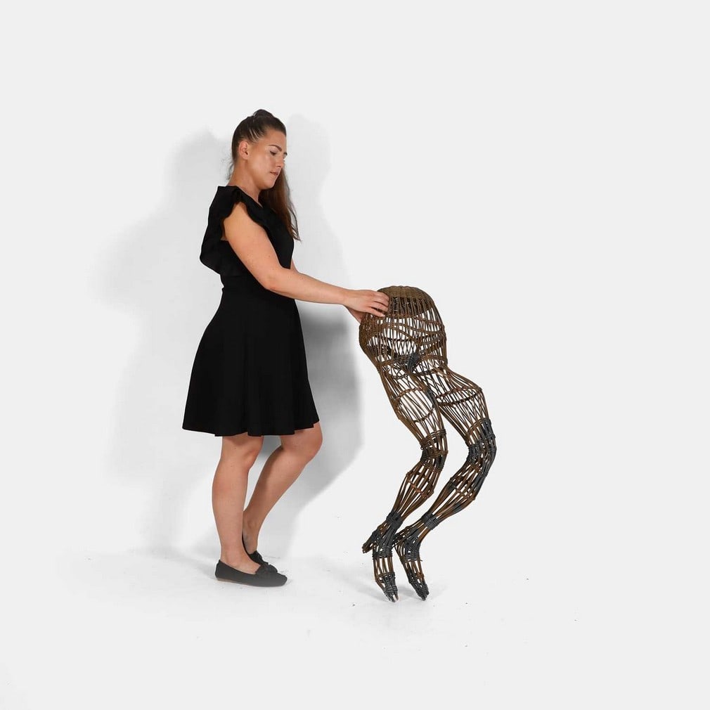 A rare wicker mannequin, circa 1920,: A rare wicker mannequin, circa 1920, modelled as the lower half of a woman, with legs and feet with high heels, (35cm wide, 52cm deep, 100cm high approximately) Condition Report: Fair overall.