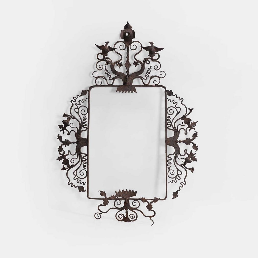 An unusual folk art picture frame, late 19th century,: An unusual folk art picture frame, late 19th century, wrought iron, with detailed Gothic scrollwork and bird motifs (57 x 39cm, aperture 31 x 21cm) Condition Report: Age and rust.